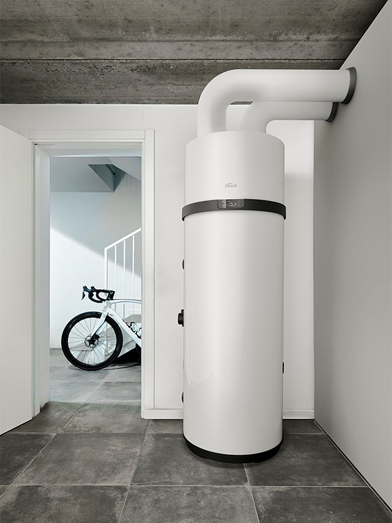 Ferroli AquaOpti heat pump water heater in a utility room with air ducts